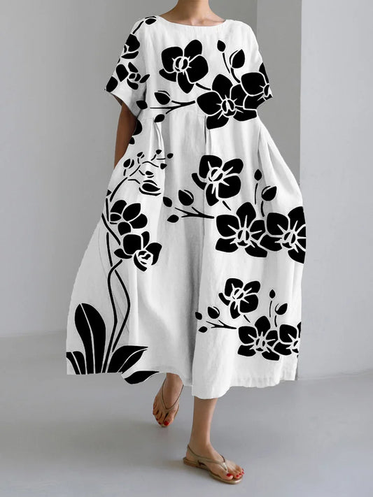 AVA - ELEGANT SVART BLOMMIG KLÄNNING